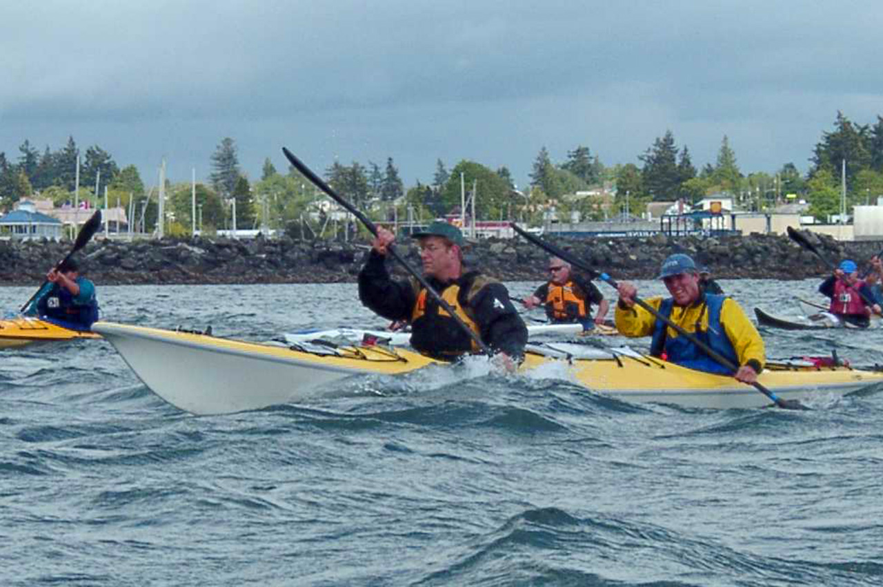 Double yellow kayak pushes ahead of the pack