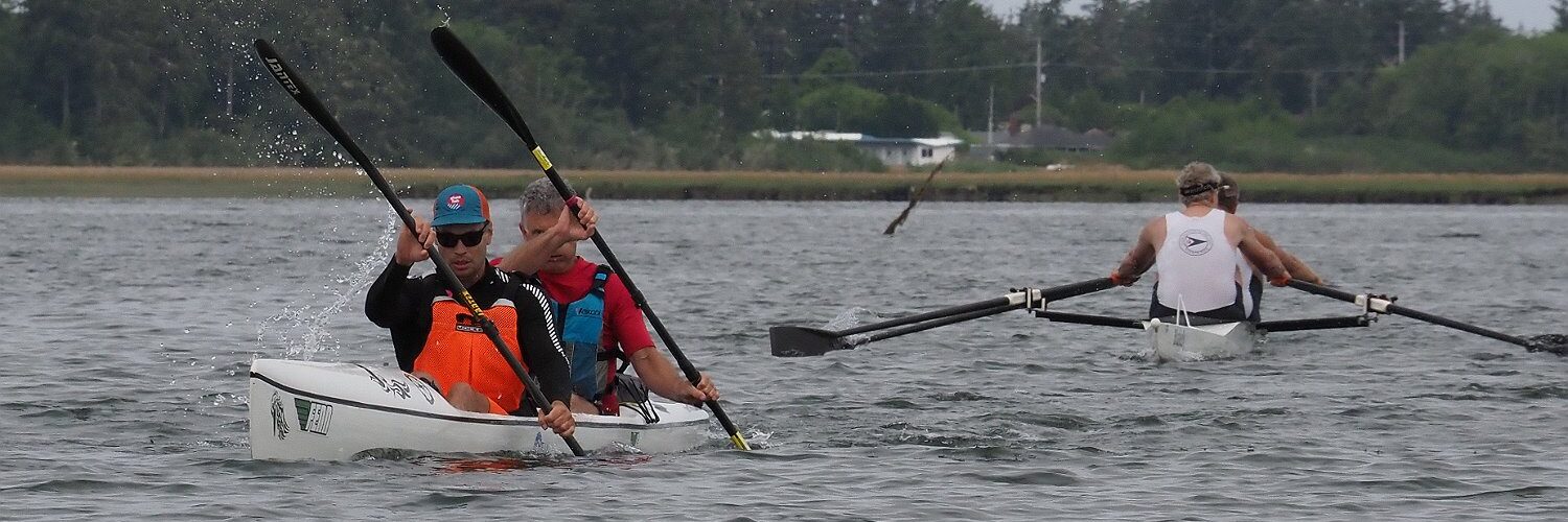 Double Scull challenging the double kayak